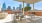 outdoor lounge and grilling area with a view of the city skyline.